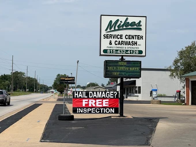 Mike's Service Center & Carwash roadside sign advertising free hail damage inspection in Watseka, IL